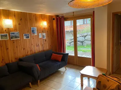 Coin salon dans l'établissement Chalet LA MOURRA