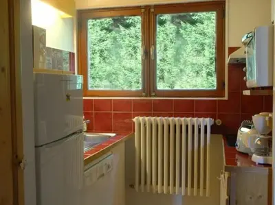 Cuisine ou kitchenette dans l'établissement Chalet l'Igloo - 14 personnes